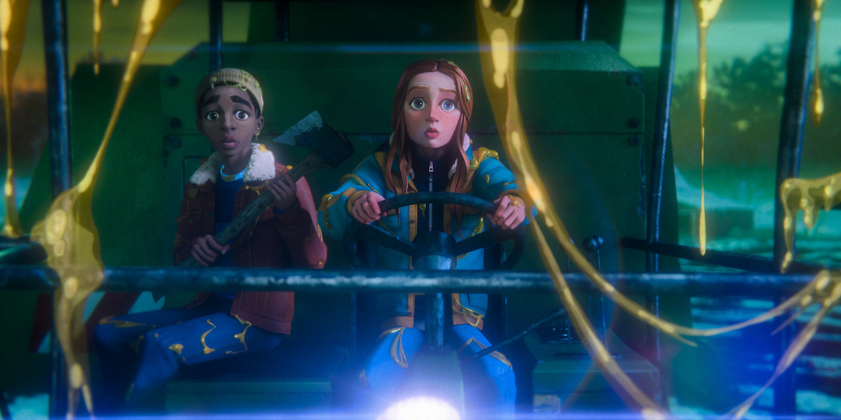 Two kids, one holding an axe and the other driving, sit in a vehicle splattered with glowing yellow goo, looking surprised and tense.