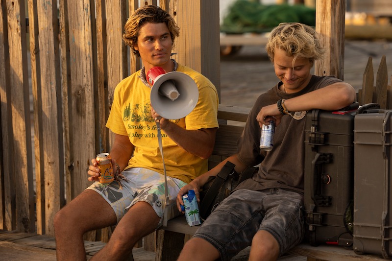 Chase Stokes as John B and Rudy Pankow as JJ in Outer Banks Season 3 Behind-the-Scenes Photo Gallery