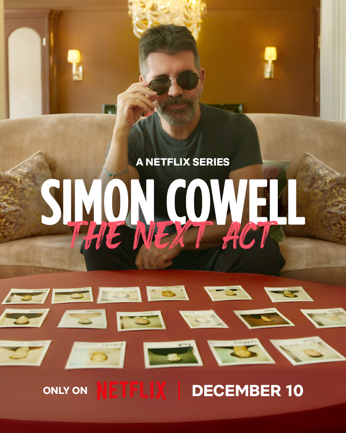 Simon Cowell looks at photos.
