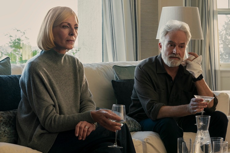 Allison Janney as Grace Penn and Bradley Whitford as Todd Penn sitting on the couch with drinks in Episode 306 of 'The Diplomat.'