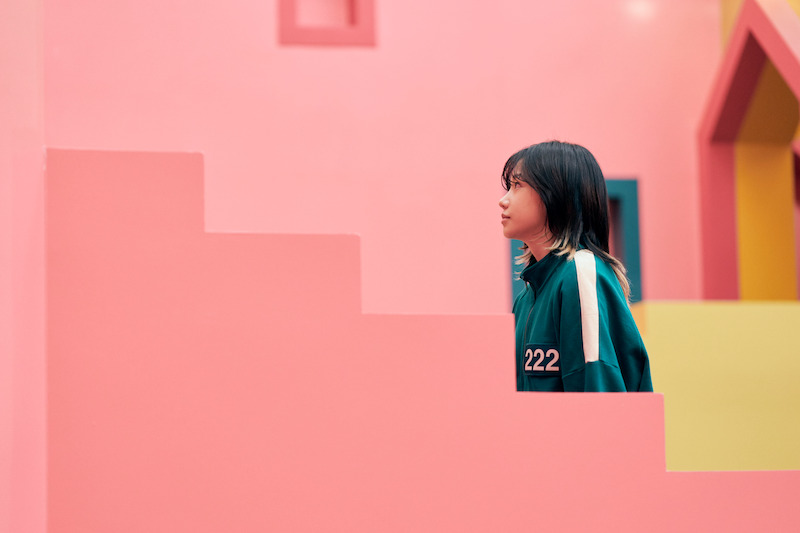 A woman walks up the stairs in Season 2 of 'Squid Game'