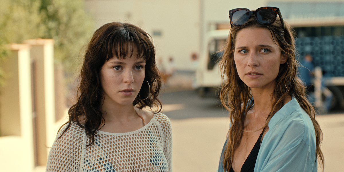 Svenja Jung as Lilli and Tijan Marei as Valeria observe the street in a production still from ‘Fall For Me.’