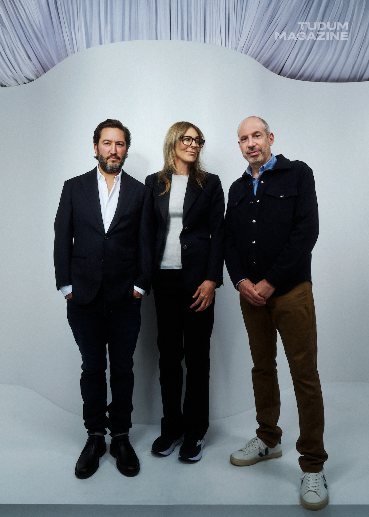 Greg Shapiro, Kathryn Bigelow, and Noah Oppenheim stand against a white backdrop.