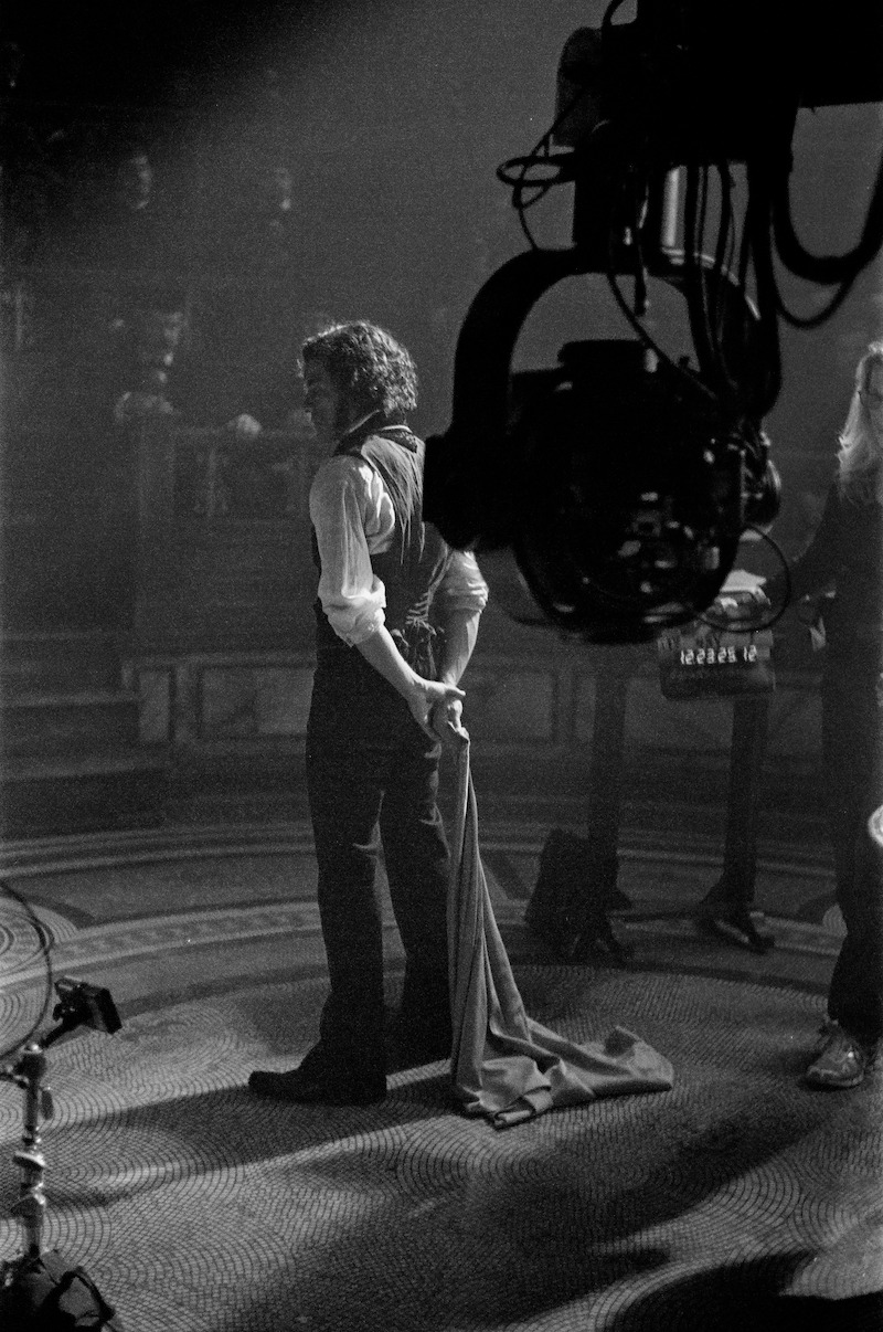 A black-and-white image of Oscar Isaac in character as Victor Frankenstein.
