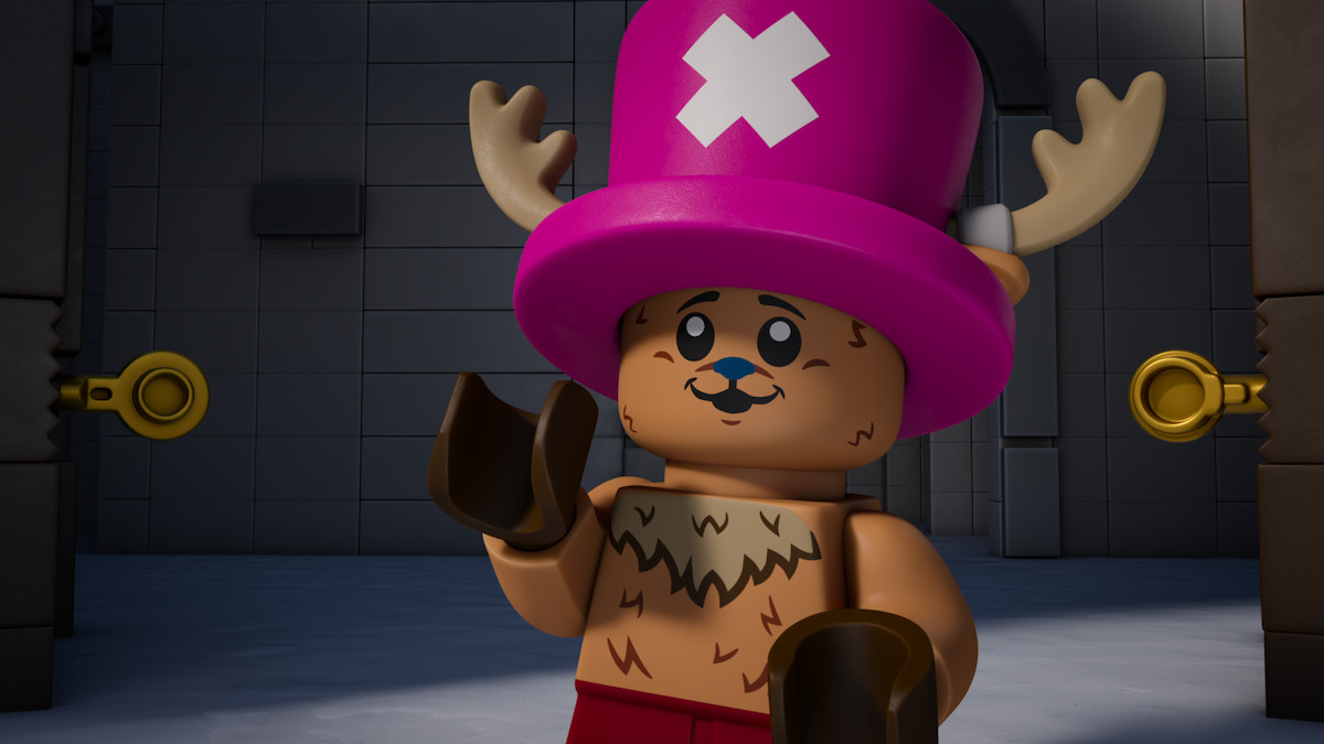 A LEGO figure with antlers and a pink hat with a white X stands in a dimly lit, gray brick room with two keyholes on either side, giving a playful expression.