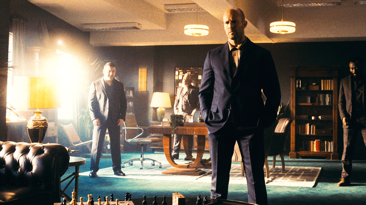 Jason Statham, as H, listens to a business deal in ‘Wrath of Man.’