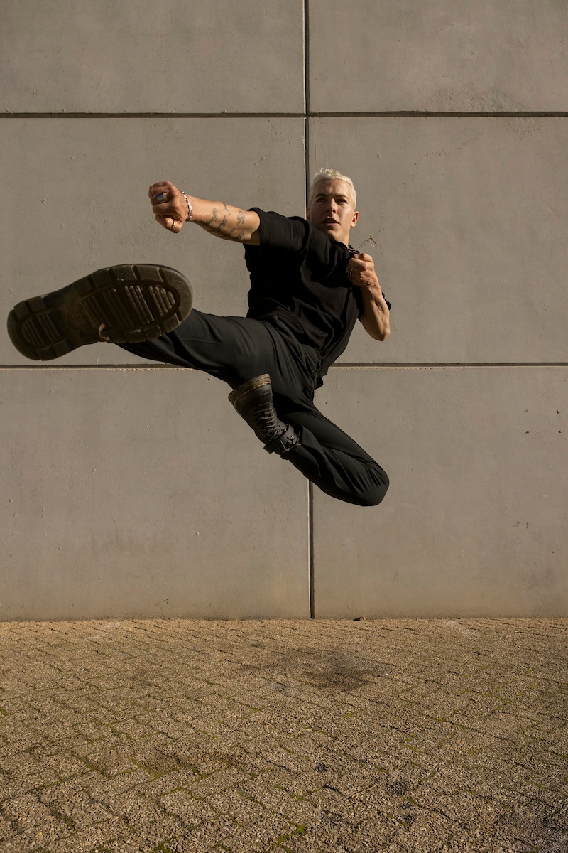 Taz Skylar performs a jumping kick on the set of Season 1 of 'One Piece.'