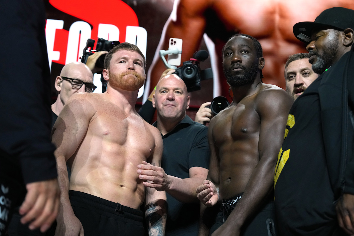 Undisputed super middleweight champion Canelo Alvarez faces off against Terence Crawford during a weigh-in ahead of their undisputed super middleweight title fight at T-Mobile Arena.