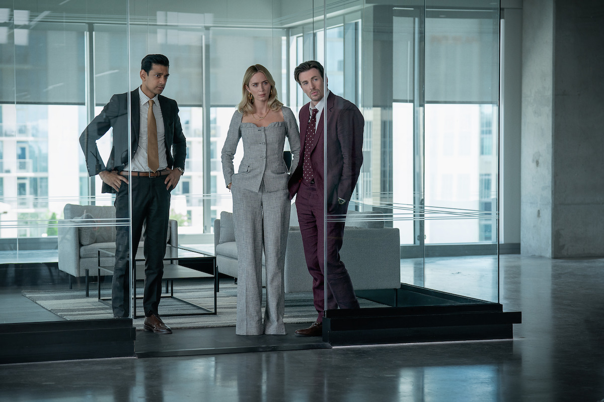 Amit Shah as Paley, Emily Blunt as Liza, and Chris Evans as Brenner.