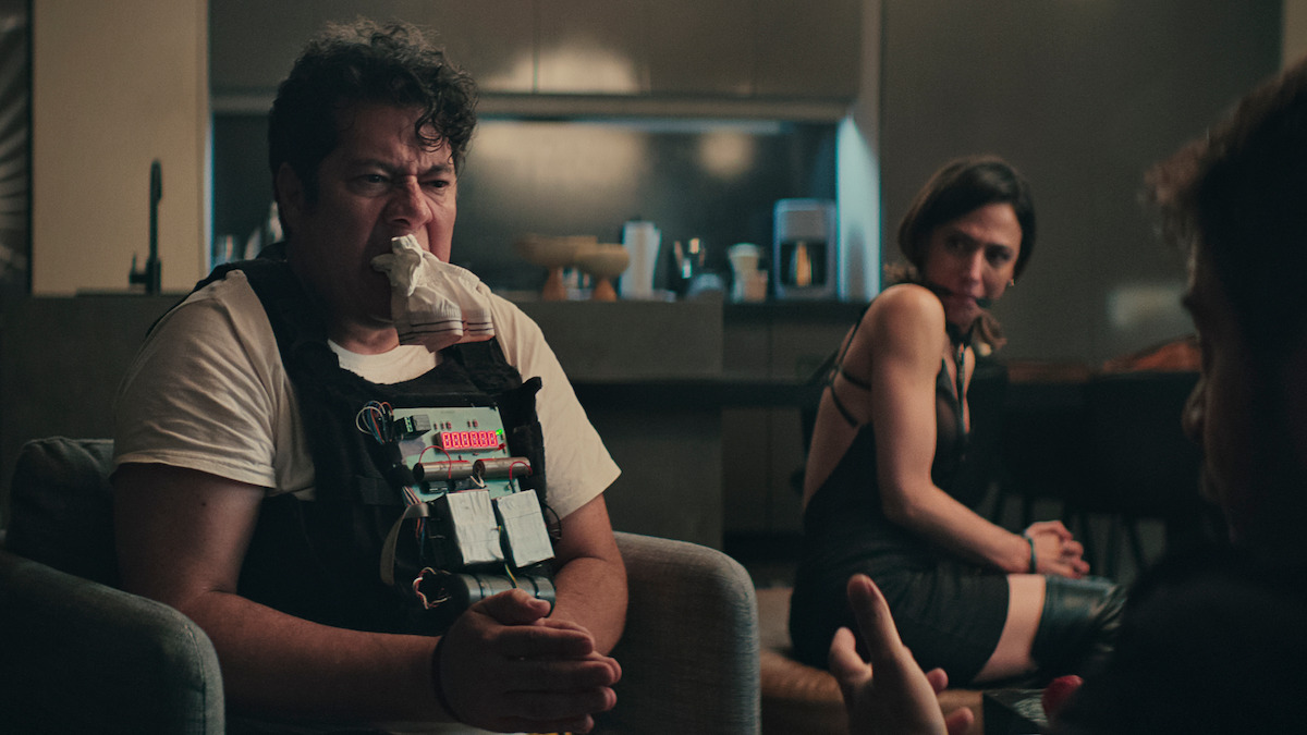 Enoc Leaño as Presidente Araiza wears a bomb strapped to his chest in ‘Non Negotiable.’