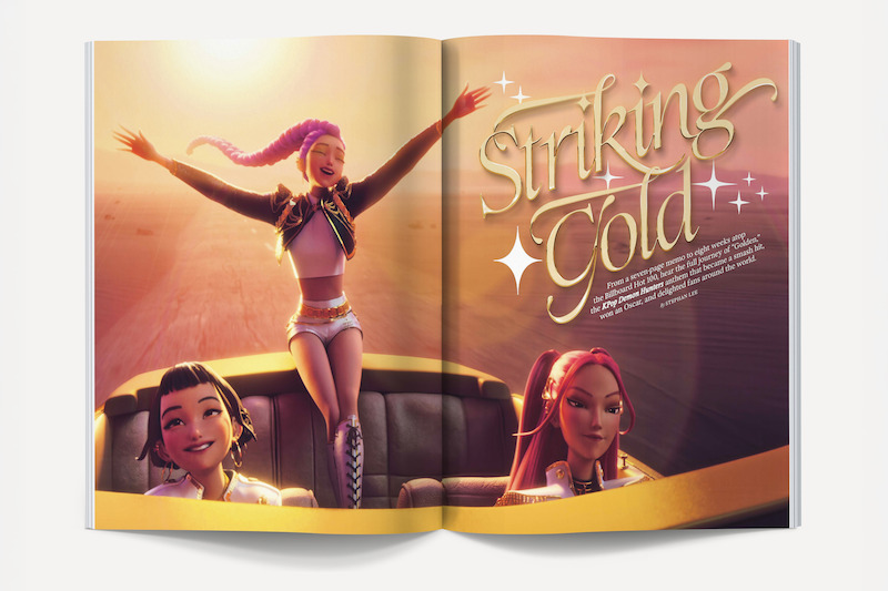 Three animated girls ride in a convertible at sunset; one stands with arms raised joyfully. The background is a sunlit open road. Magazine text reads "Striking Gold" with sparkles on the right page.