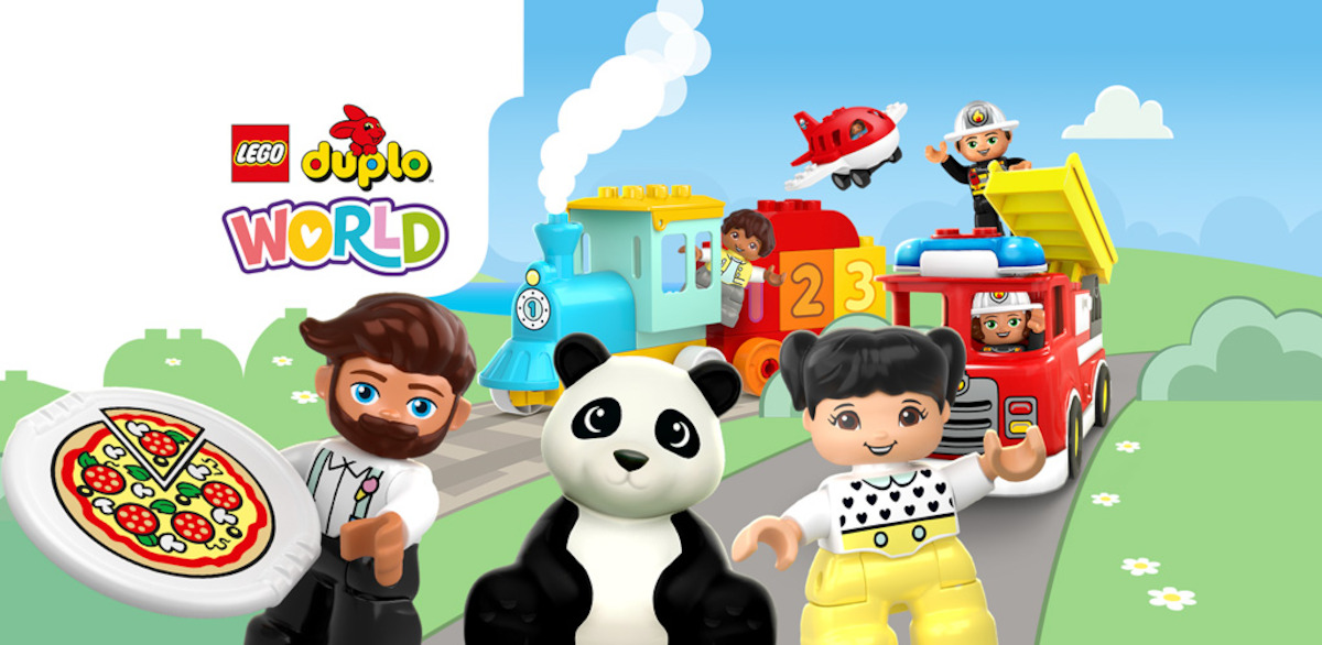 LEGO DUPLO figures and a panda in a colorful play world with a pizza, train, fire truck, and plane, set outdoors with blue sky and clouds, evoking a playful and cheerful atmosphere.