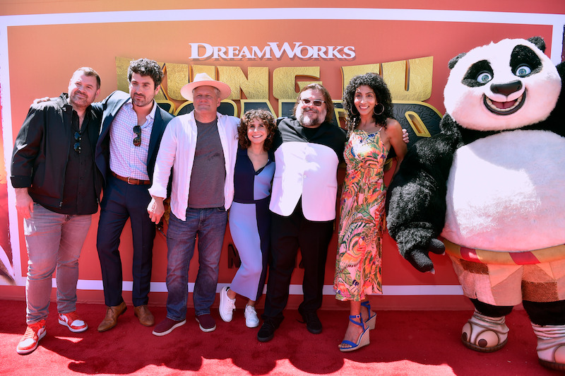 The cast and crew (and panda) of Kung Fu Panda: The Dragon Knight on the red carpet.
