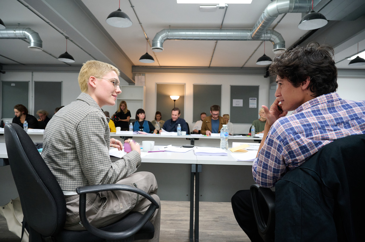 Emily Carey and Liam Woodrum at a table read for ‘Geek Girl’ Season 2