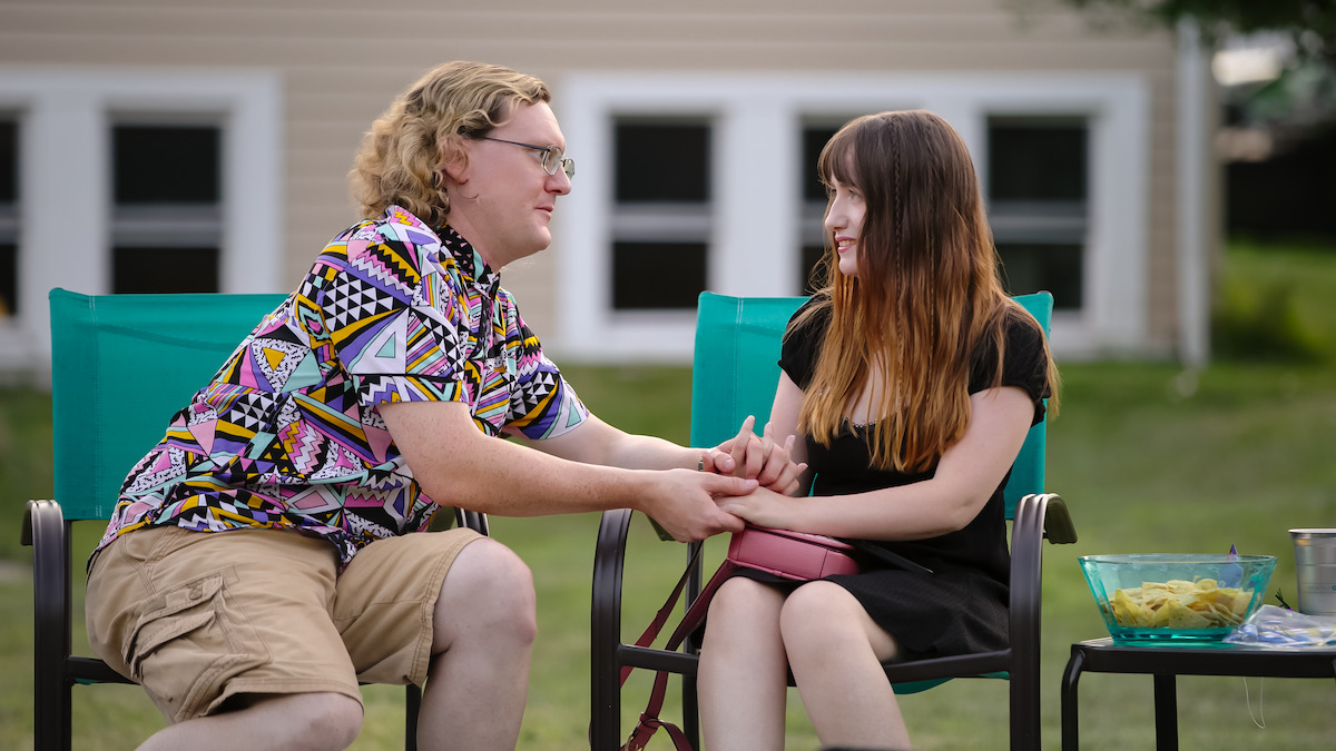 James and Shelley holding hands.