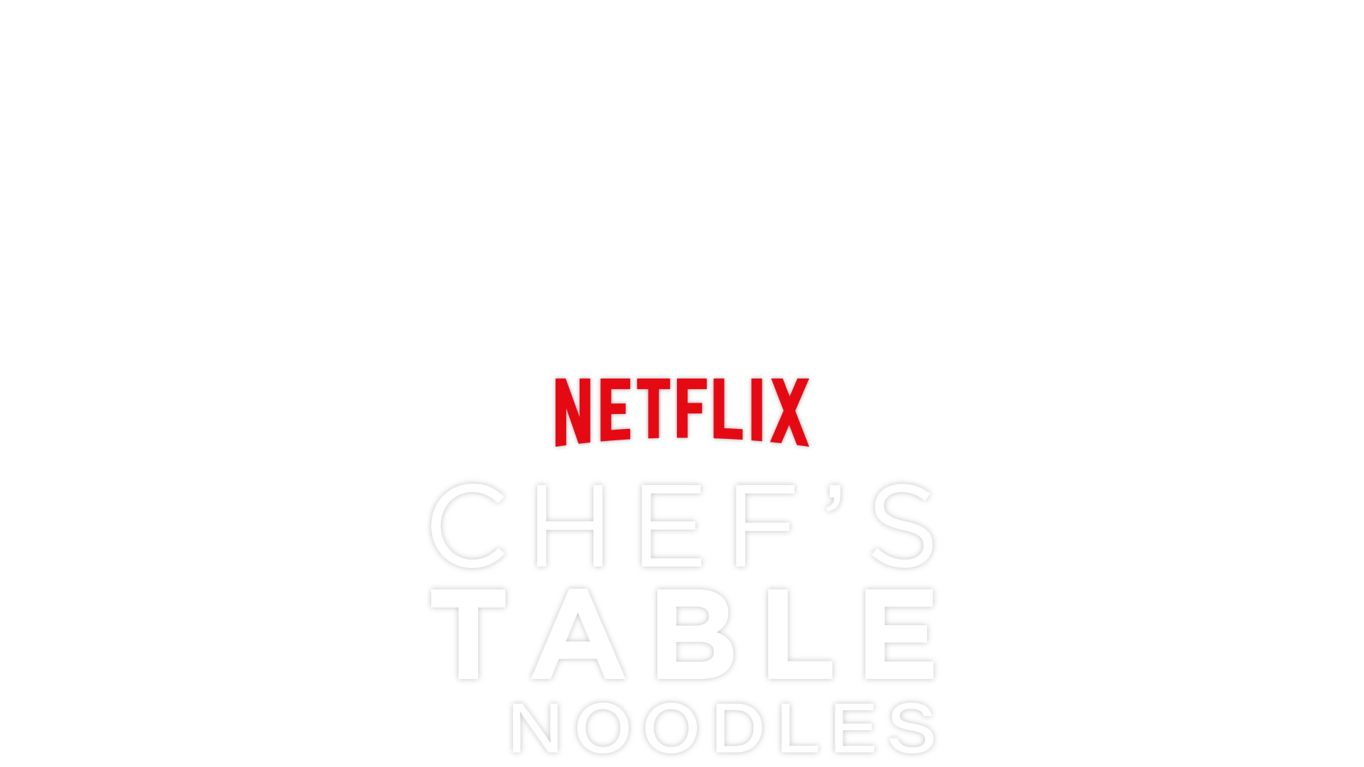 A view looking down on a table that is holding several bowls of ramen noodles. 