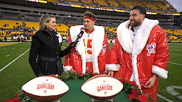 Patrick Mahomes and Travis Kelce wearing Netflix/NFL Christmas jackets during a postgame interview with Stacey Dales.