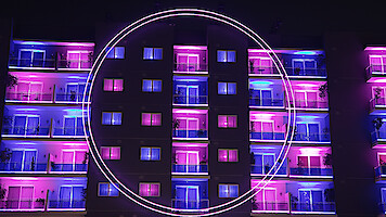 An exterior view of 'The Circle' apartments from Season 6.