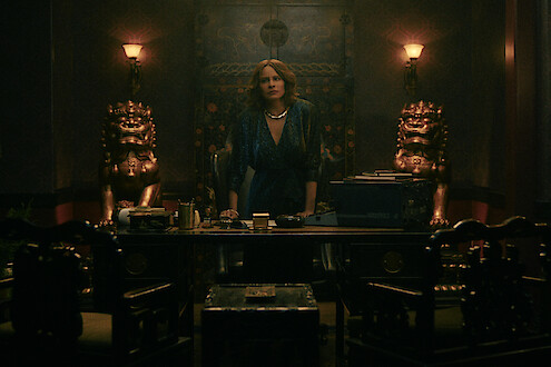 Sofia Vergara as Griselda behind a desk