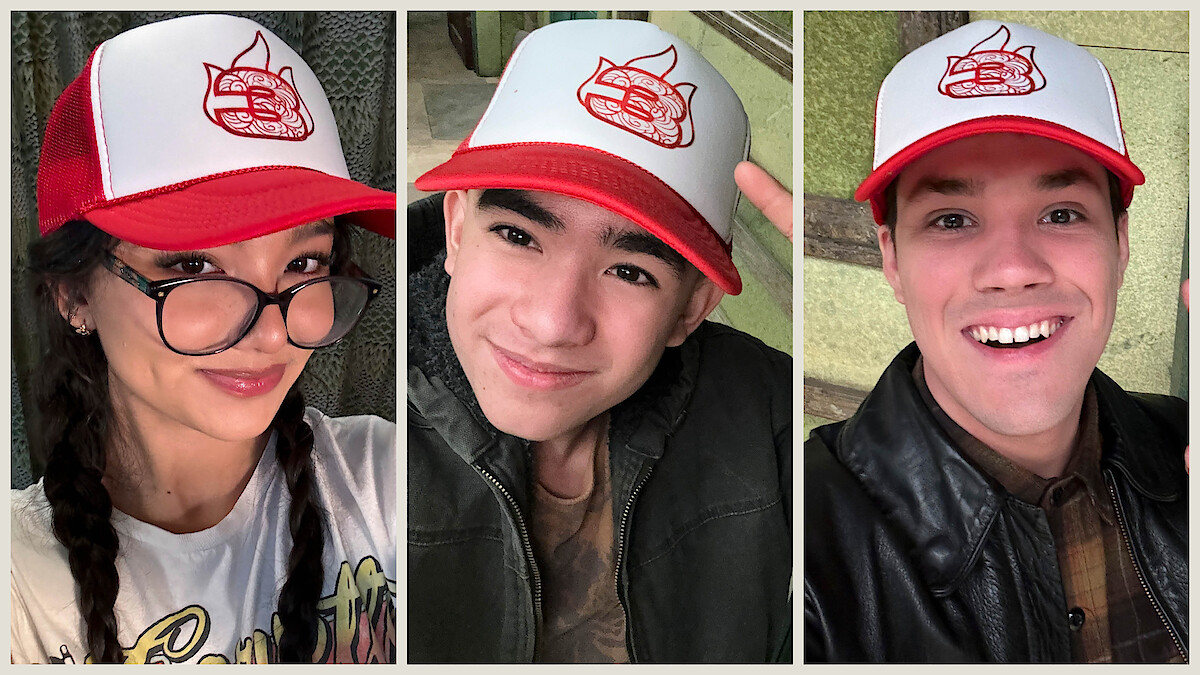 Kiawentiio, Gordon Cormier, and Ian Ousley wear a hat with a 3 and the 'Avatar: The Last Airbender' Fire Nation logo on it. 