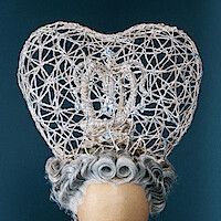 A close-up of Queen Charlotte's masquerade ball cage wig