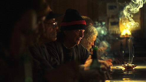 Cast of The Singers pictured seated belly up to the bar.