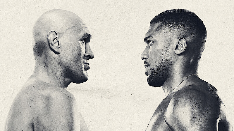 Two muscular male boxers facing each other, close-up, shirtless, intense expressions, neutral background, monochrome style, suggesting a tense pre-fight stare down or promotional photo.