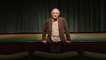  Robert De Niro leans on a stage