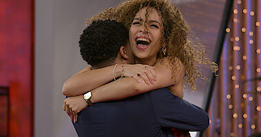 Milton Johnson and Lydia Velez Gonzalez hugging.