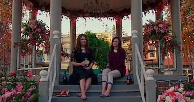 Lorelai and Rory sitting in the Stars Hollow Gazebo