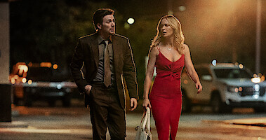 Chris Evans as Pete Brenner and Emily Blunt as Liza.