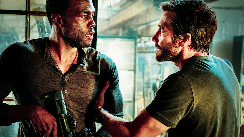 Yahya Abdul-Mateen II as Will Sharp and Jake Gyllenhaal as Danny Sharp argue in 'Ambulance.'  