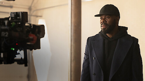 Behind the scenes image of a camera filming Colman Domingo in Season 1 of 'The Madness'
