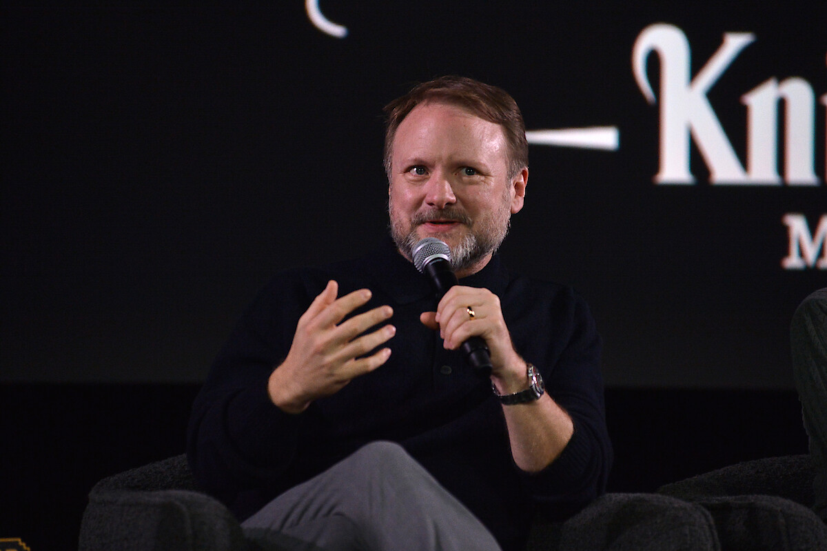 Rian Johnson sits on stage during the panel from The Lineup