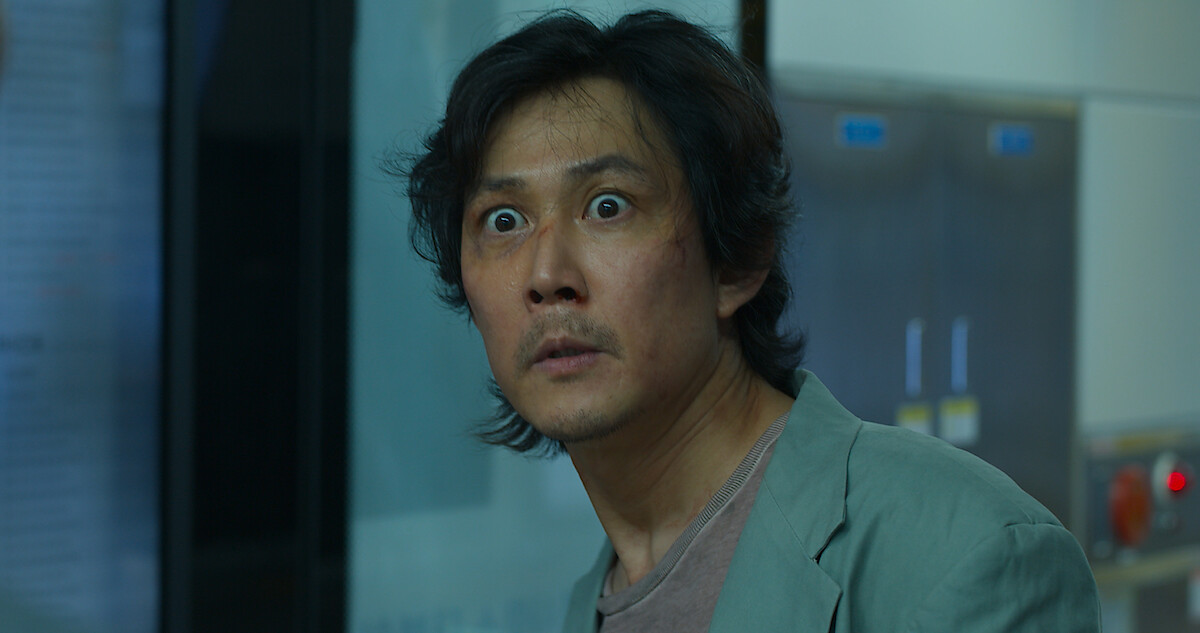 An image of a man playing 'Squid Game'