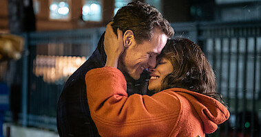 Sam Heughan as Rob Burns and ​Priyanka Chopra Jonas as Mira Ray embrace in 'Love Again.'