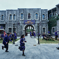 Students in the Nevermore Academy courtyard in ‘Wednesday’ Season 2.