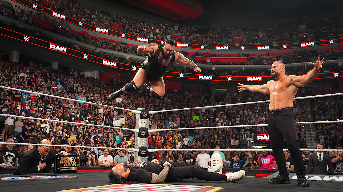 Bronson Reed comes down with a Tsunami to Roman Reigns while Bron Breakker looks on during Monday Night RAW at Little Caesars Arena on July 28, 2025 in Detroit, Michigan