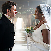 Jonathan Bailey as Anthony Bridgerton and Simone Ashley as Kate Sharma stand in wedding attire together in Season 2 of 'Bridgerton'