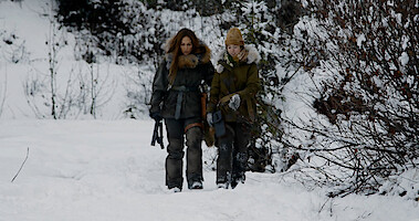 Jennifer Lopez and Lucy Paez walking in snow