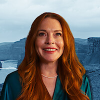 Lindsay Lohan in front of a backdrop of Ireland.