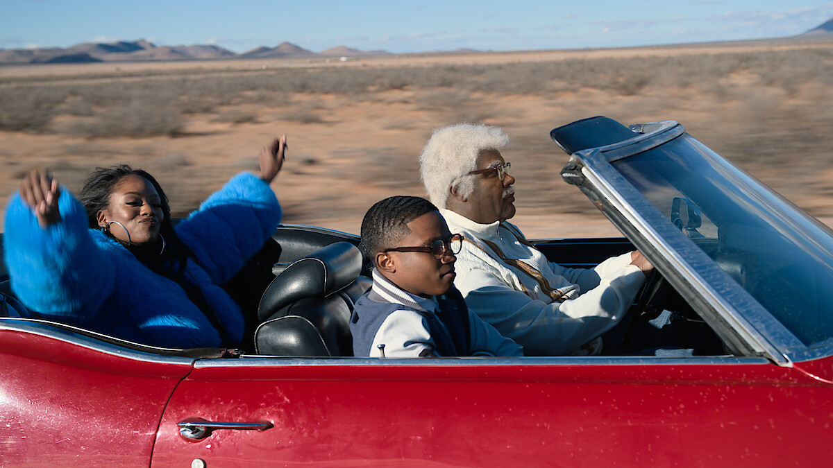 Amber Reign as Destiny, Jermaine Harris as B.J. and Tyler Perry driving in a red convertible as Joe in 'Joe’s College Road Trip.'
