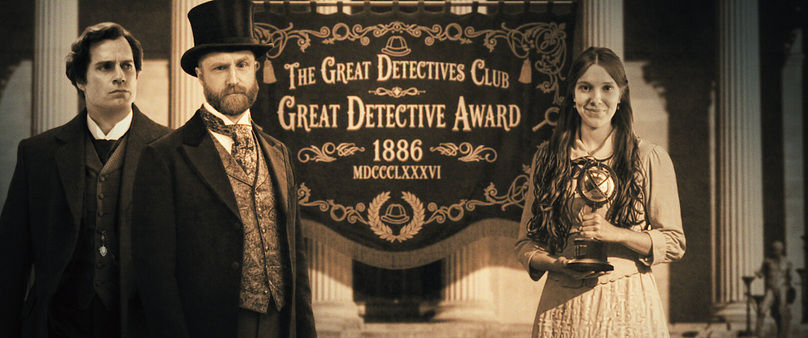 Three people in Victorian-era attire stand before a banner reading "The Great Detectives Club Great Detective Award 1886"; one woman holds a trophy, the scene set within grand architectural columns, evoking a formal ceremony.