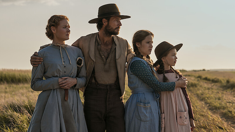 A family looks off into the distance together.