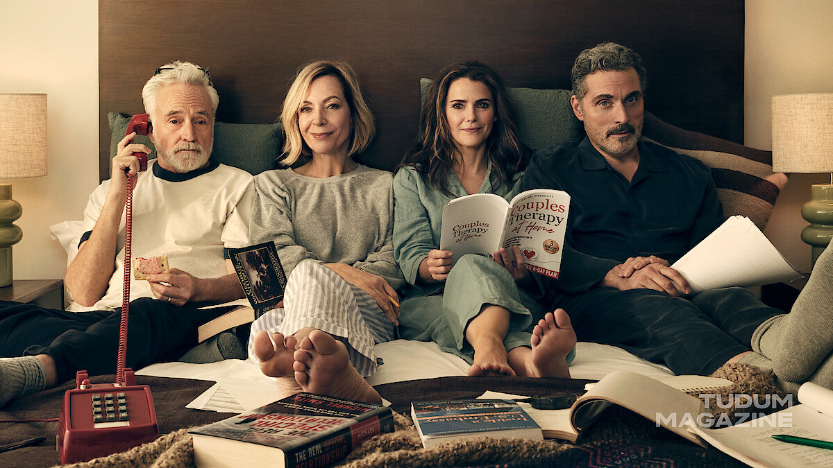 Keri Russell, Rufus Sewell, Allison Janney, and Bradley Whitford lounge in their pajamas together in bed.