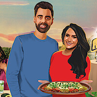 A man in a blue shirt and a woman in a red shirt holding a tray of food stand together at an outdoor gathering at sunset, with drinks and people in the background.