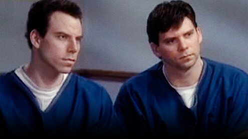 Erik and Lyle Menendez in blue prison jumpsuits.