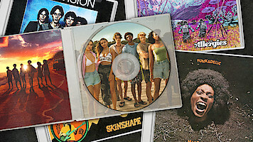 Outer Banks cast featured on a CD case sitting on top of a pile of other CDs, featuring The xx, Ella Fitzgerald and Luis Armstrong and alt-J.