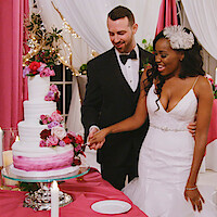 Lauren and Cameron cutting their wedding cake in 'Love Is Blind' Season 1.
