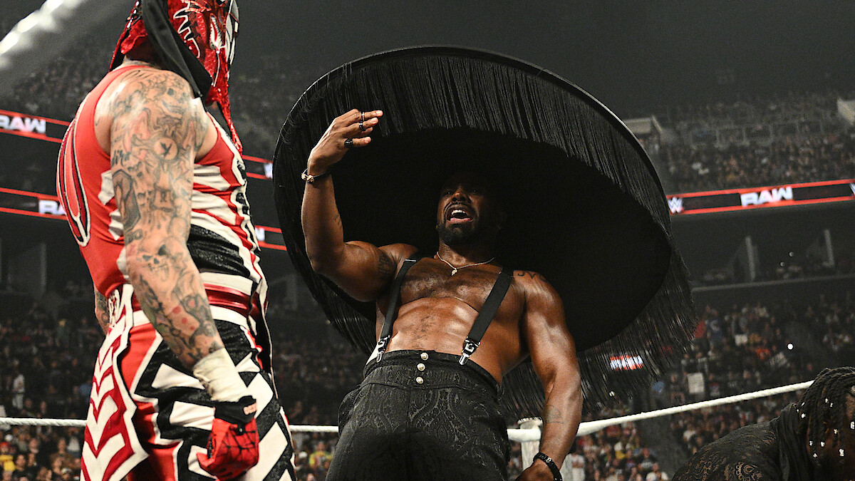 Xavier Woods gestures towards Penta in the ring.